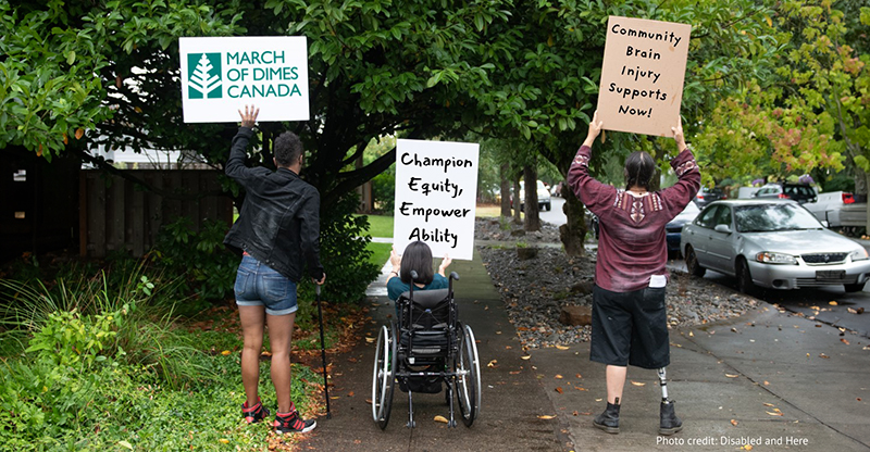 Three people with various disabilities hold up signs - MODC logo, Champion Equity Empower Ability, Community BI Supports Now!