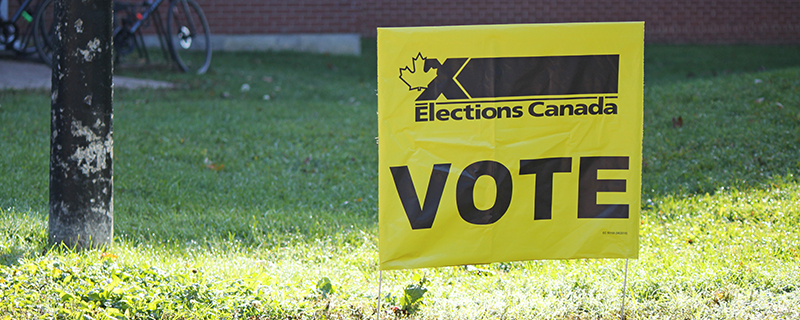 Elections Canada yellow and black Vote sign
