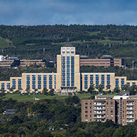 Confederation Building in St. John's Newfoundland - beige building against hill background