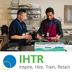 IHTR - Inspire, Hire, Train, Retain. Person training in a kitchen with a supervisor