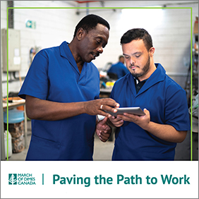 MODC Paving the Path to Work - A warehouse worker showing a younger man info on a tablet