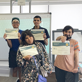 Paving the Path to Work graduates showing their certificates of completion