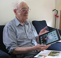 Man using iPad for communication