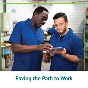 MODC Paving the Path to Work - A warehouse worker showing a younger man info on a tablet